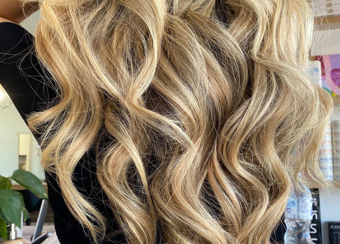 Blonde hair with waves styled at Vuda, Melbourne, Victoria, AU showcasing vibrant salon services.