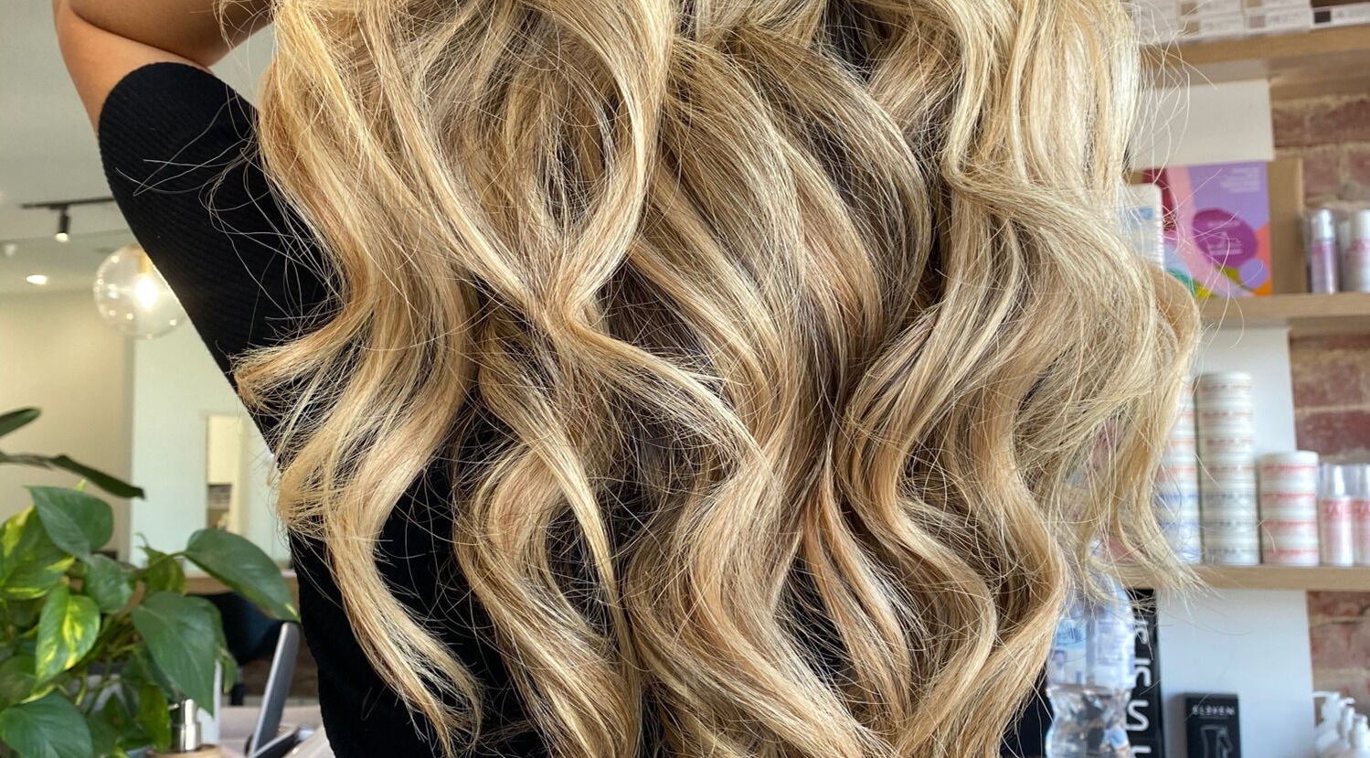 Blonde hair with waves styled at Vuda, Melbourne, Victoria, AU showcasing vibrant salon services.