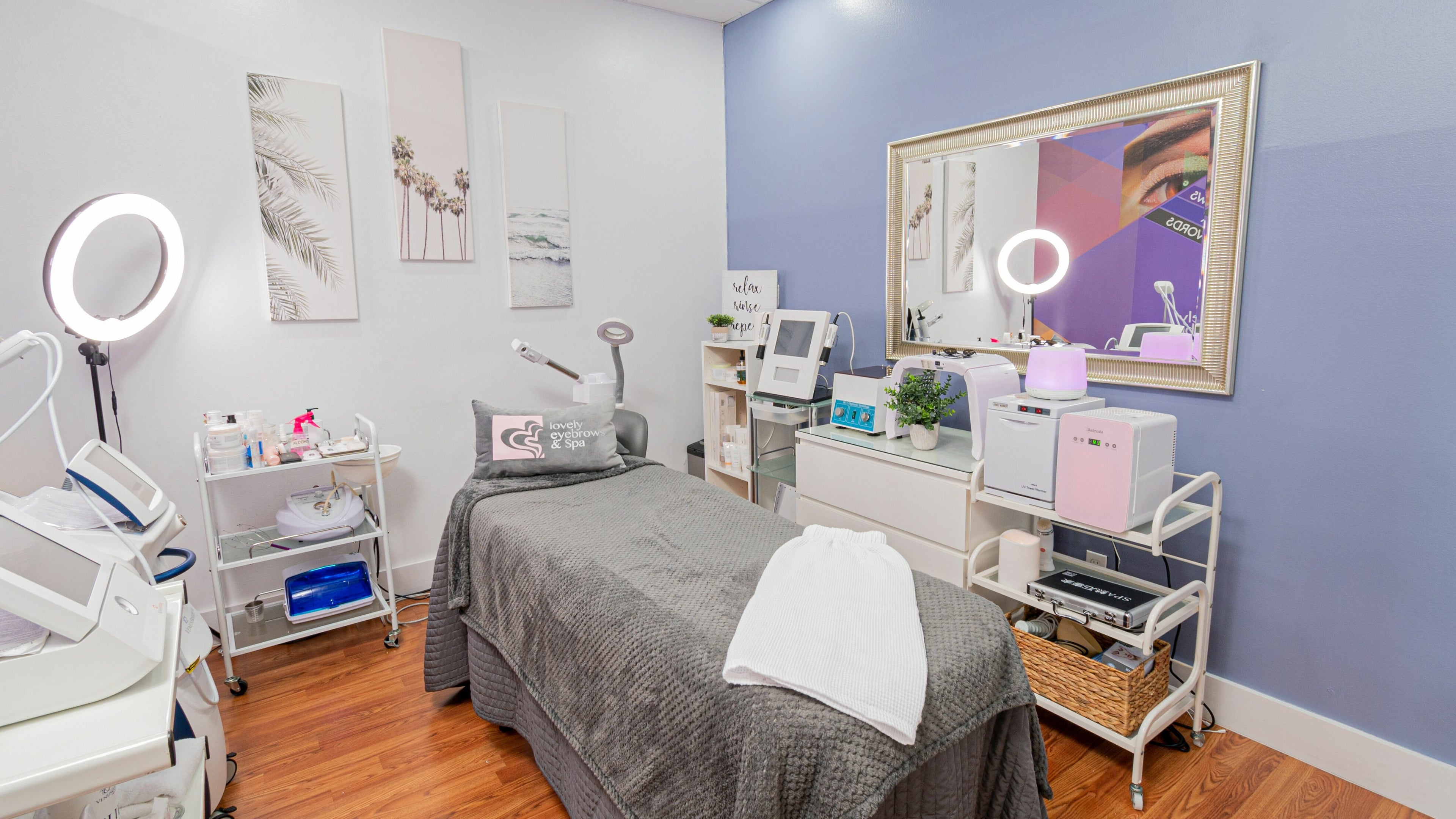 Relaxing treatment room at Doral Lovely Eyebrow Spa, Doral, Florida, US featuring modern skincare equipment.