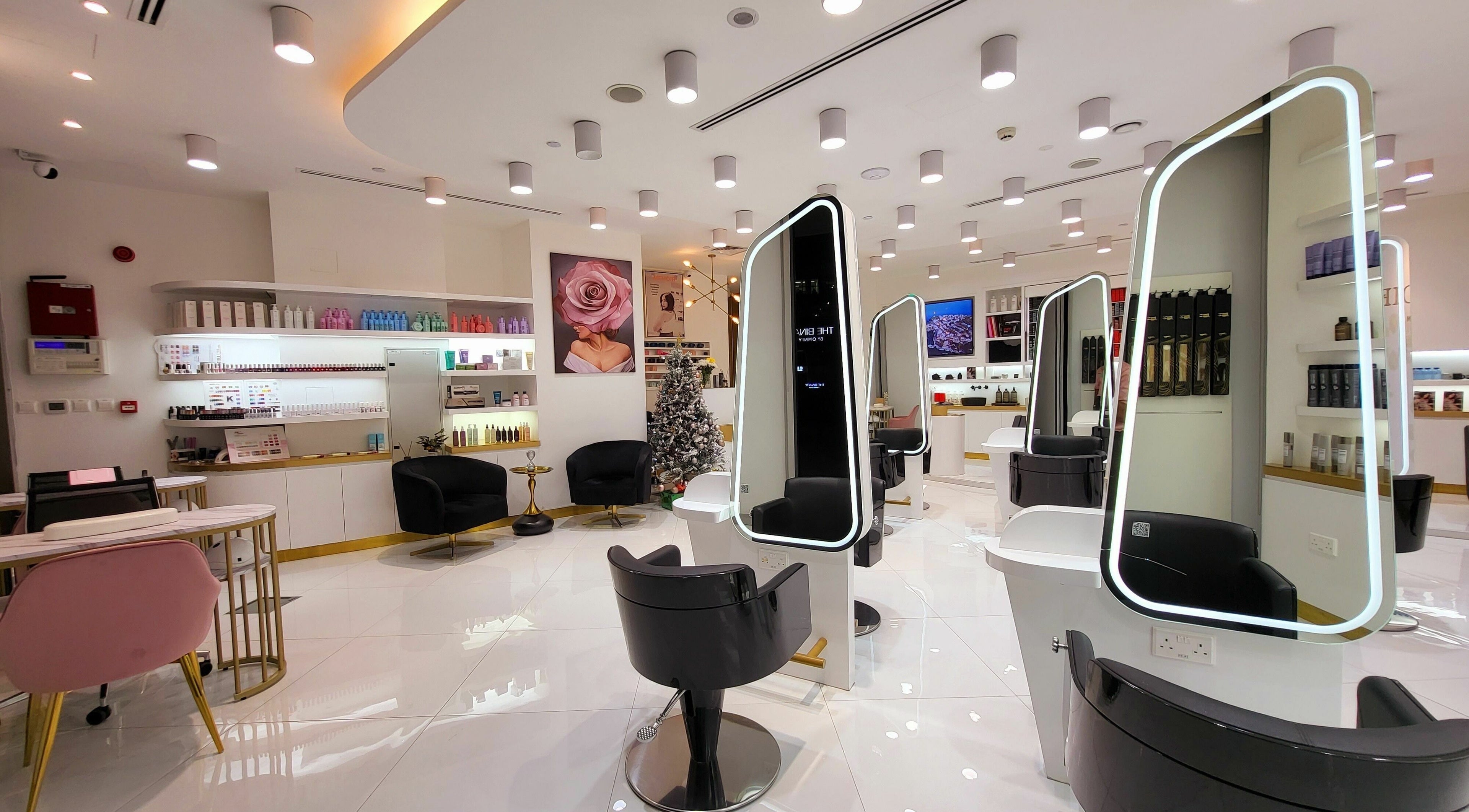 Spacious and modern interior of Memoir Beauty Salon in Dubai, Dubai, AE, showcasing luxury styling stations.