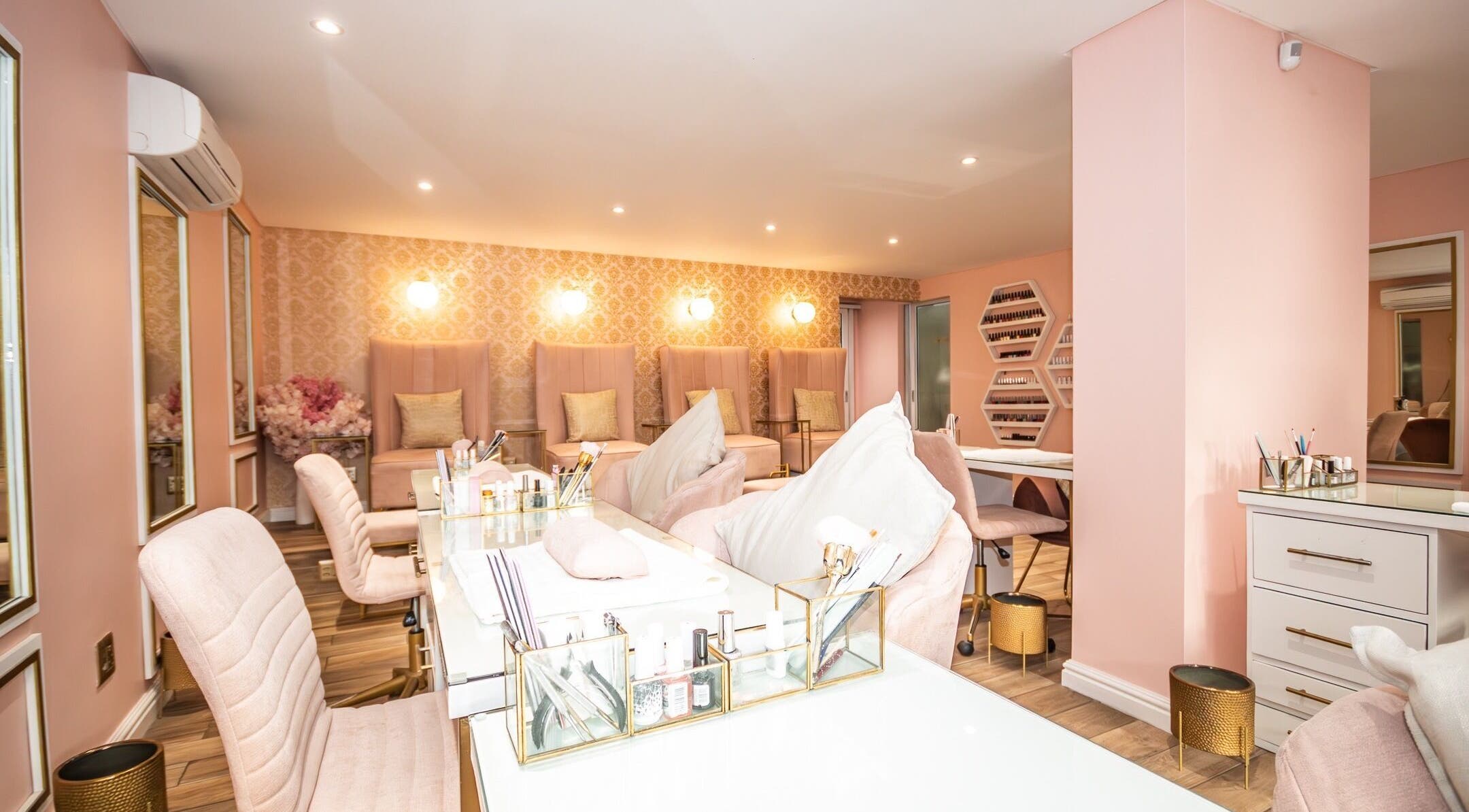 Elegant interior of Rose Blvd Beauty Bar SEA POINT, Cape Town, Western Cape, ZA with plush seating and soft lighting.