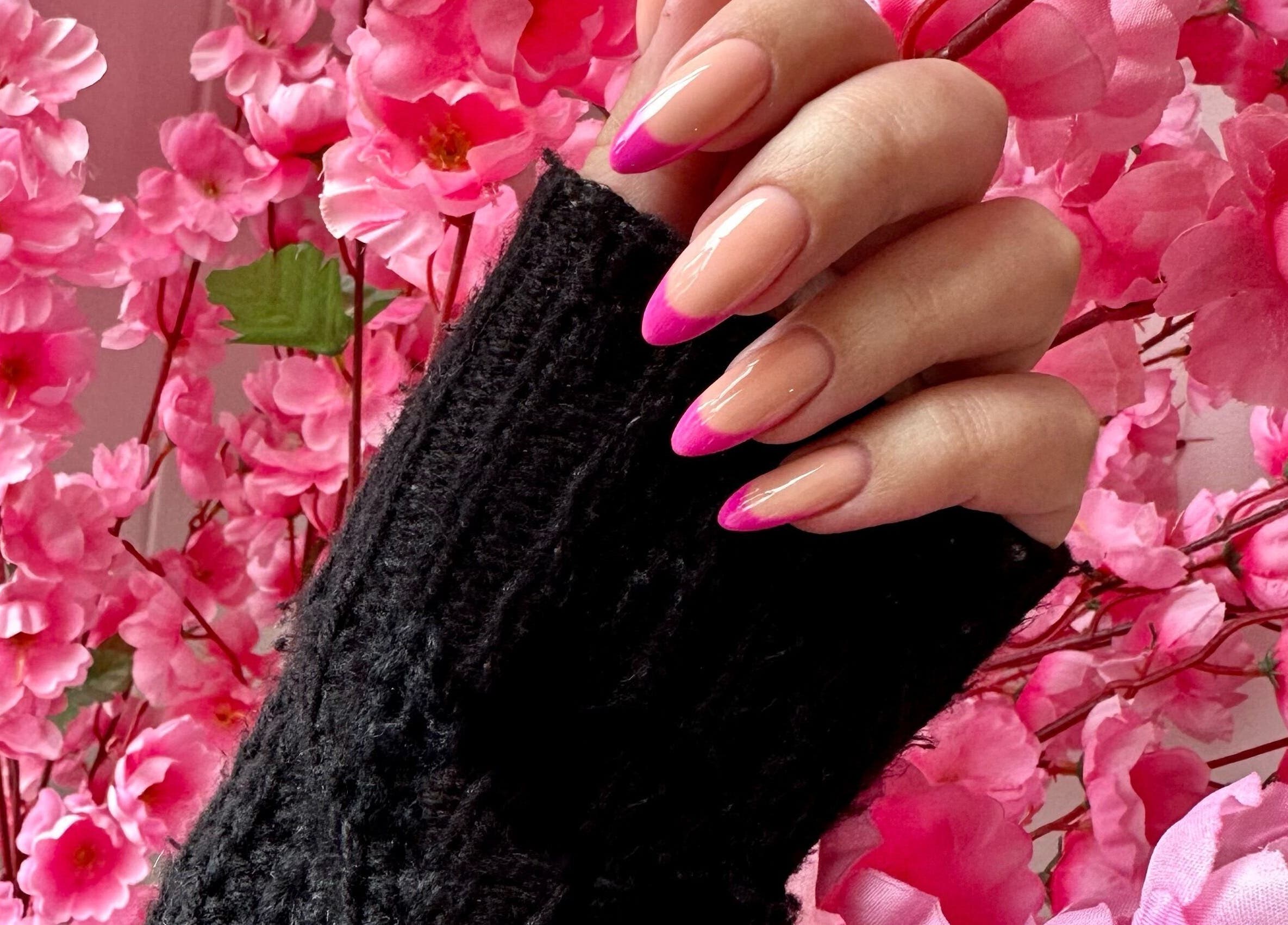 Elegant pink French manicure at Rose Blvd Beauty Bar SEA POINT, Cape Town, Western Cape, ZA, amid cherry blossoms.