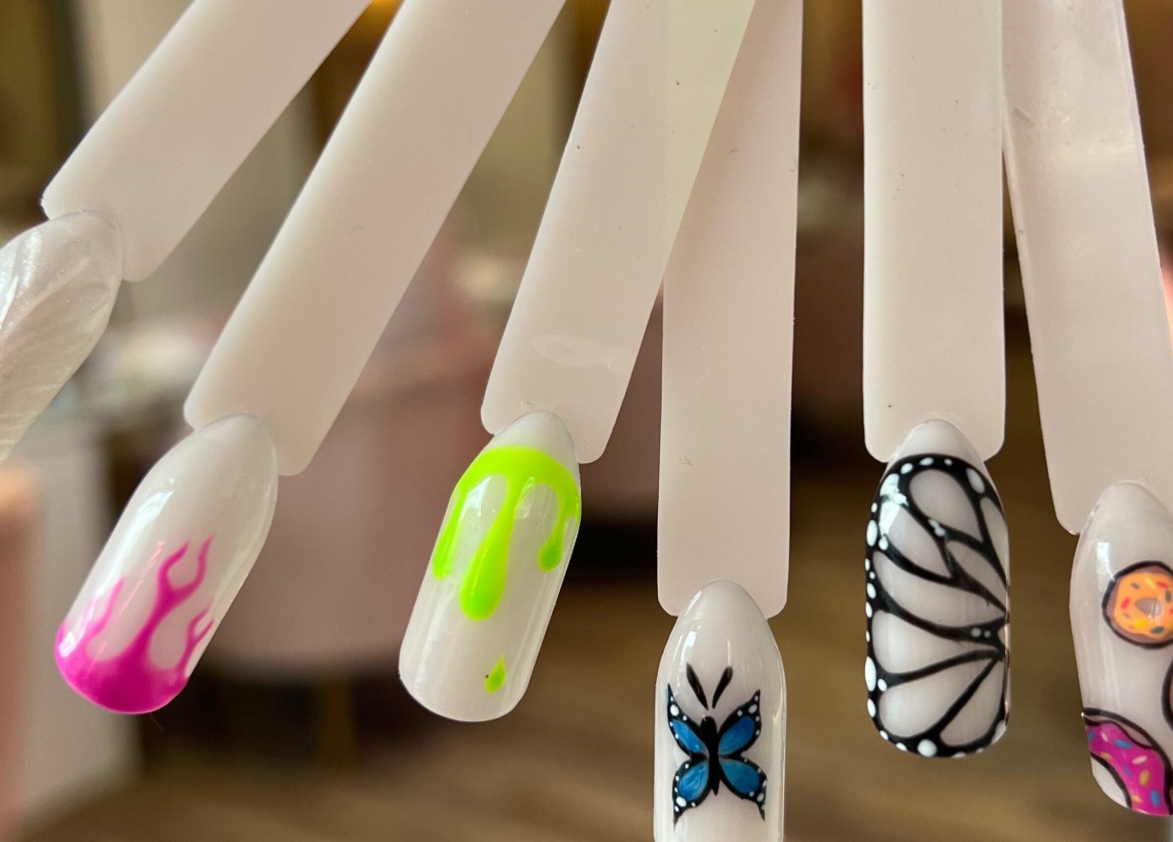 Creative nail art samples at Rose Blvd Beauty Bar SEA POINT, Cape Town, Western Cape, ZA showcasing vibrant designs.