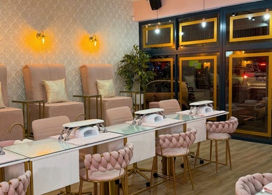 Luxurious interior of Rose Blvd Beauty Bar Regent Road in Cape Town, stylish decor and plush seating visible.