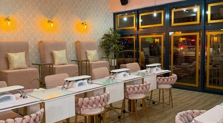Luxurious interior of Rose Blvd Beauty Bar Regent Road in Cape Town, stylish decor and plush seating visible.