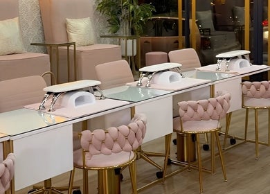 Elegant nail stations at Rose Blvd Beauty Bar Regent Road in Cape Town, Western Cape, ZA with plush seating.