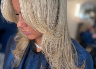 Blonde hair styled with smooth waves at Hair By Kacie Leigh, N, England, GB.