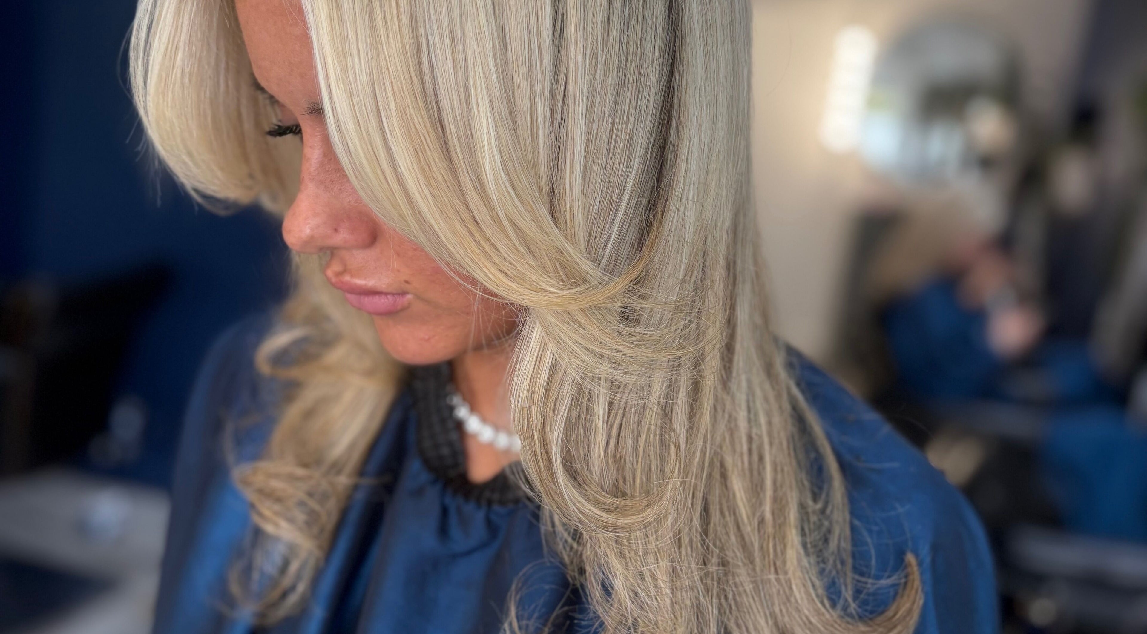 Blonde hair styled with smooth waves at Hair By Kacie Leigh, N, England, GB.