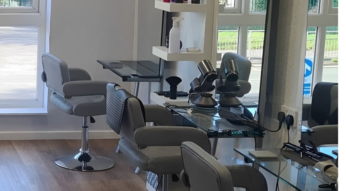 Modern hair salon setup at Ki-ki's Hair and Beauty in Codsall, England, GB, featuring sleek chairs and styling stations.