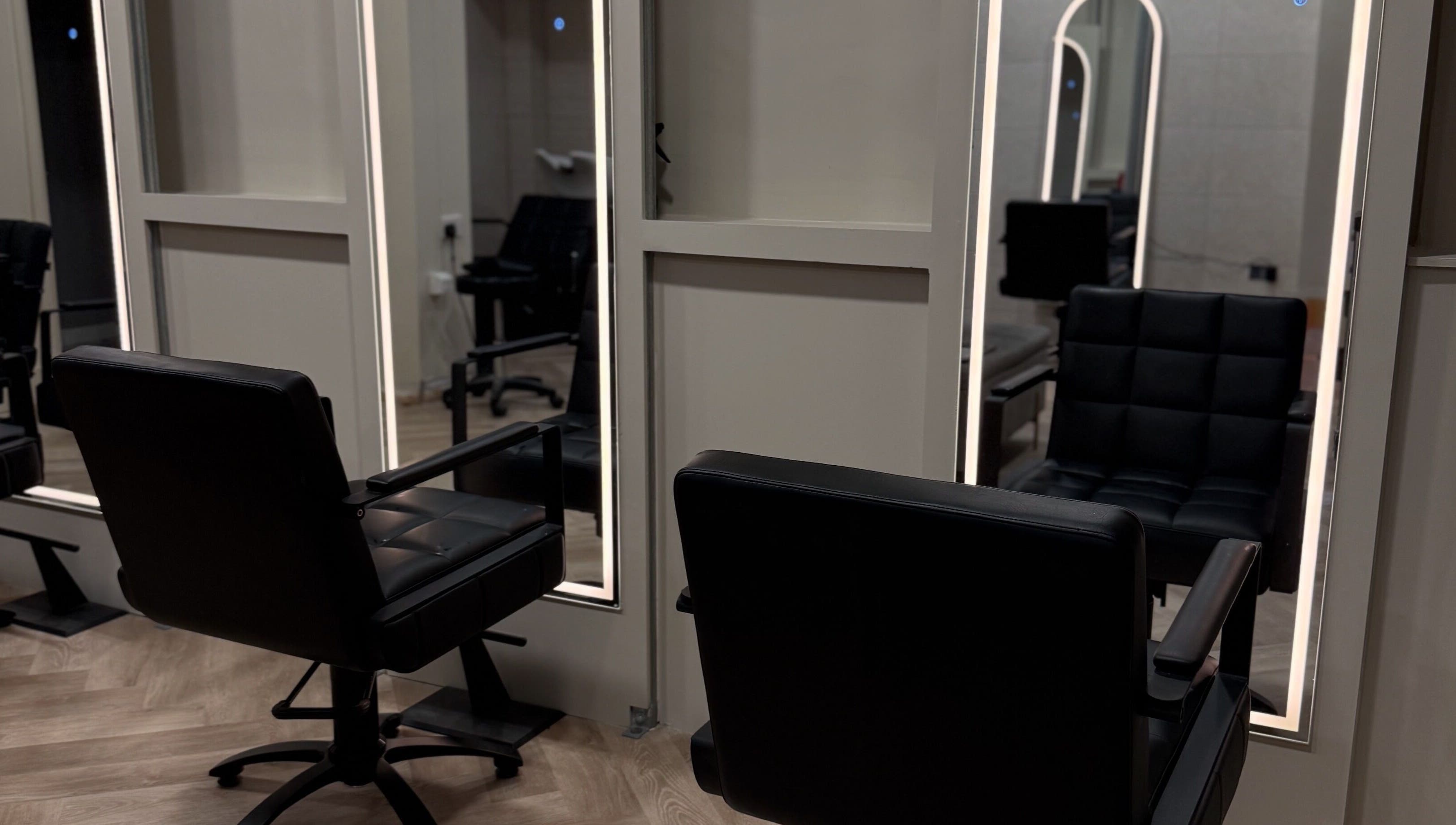 Modern salon chairs at Autumn & Easton, Glasgow, Scotland, GB, reflecting stylish interior design.