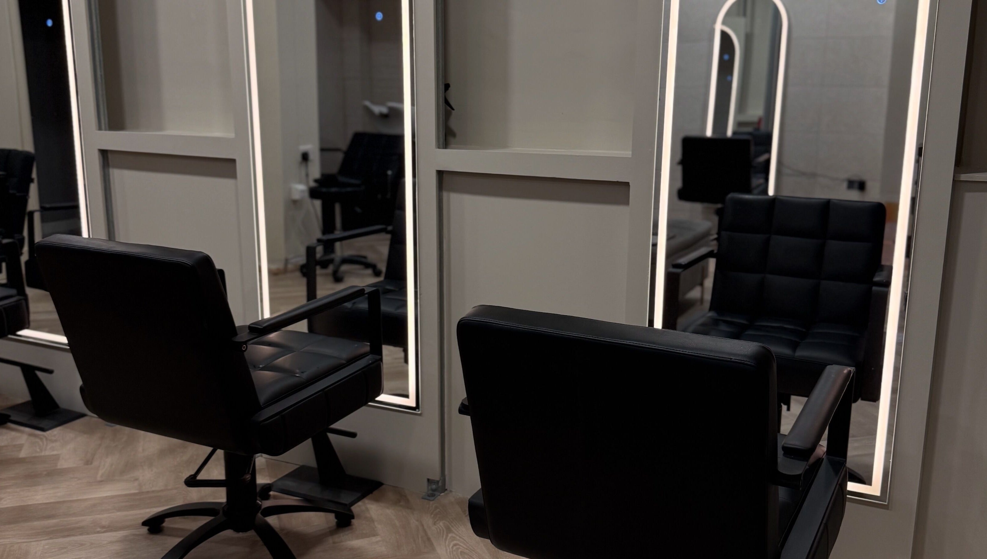 Modern salon chairs at Autumn & Easton, Glasgow, Scotland, GB, reflecting stylish interior design.