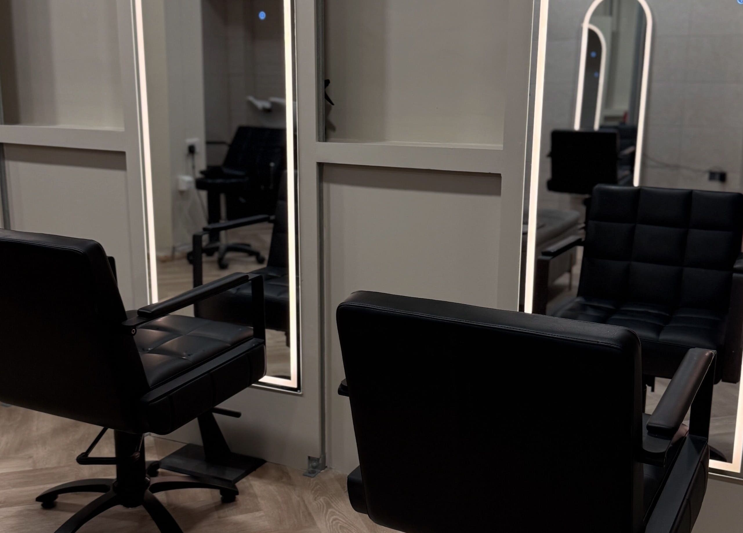 Modern salon chairs at Autumn & Easton, Glasgow, Scotland, GB, reflecting stylish interior design.