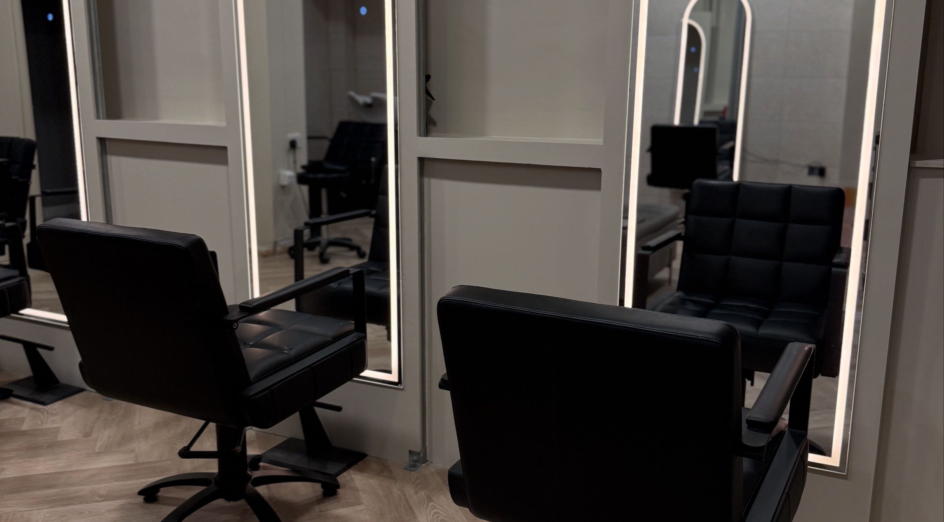 Modern salon chairs at Autumn & Easton, Glasgow, Scotland, GB, reflecting stylish interior design.