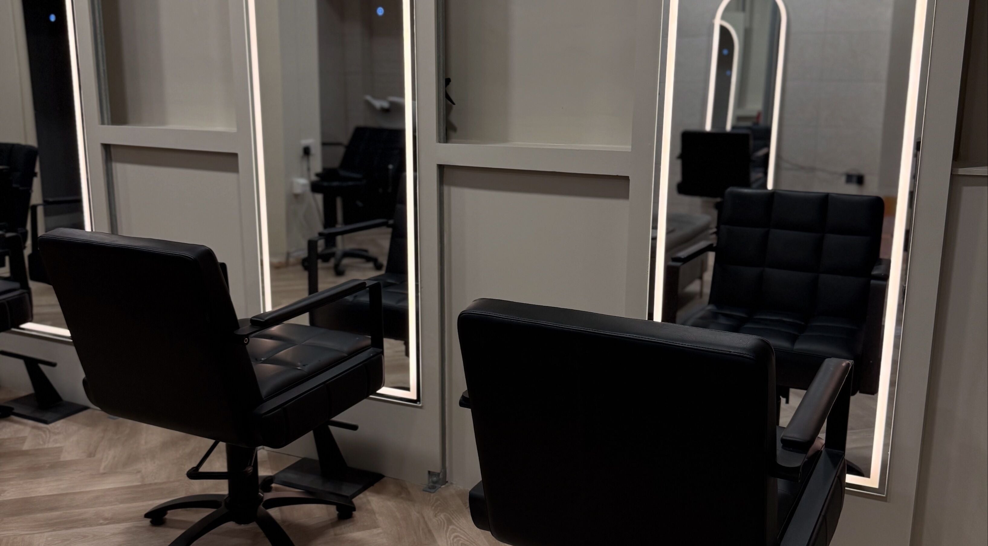 Modern salon chairs at Autumn & Easton, Glasgow, Scotland, GB, reflecting stylish interior design.