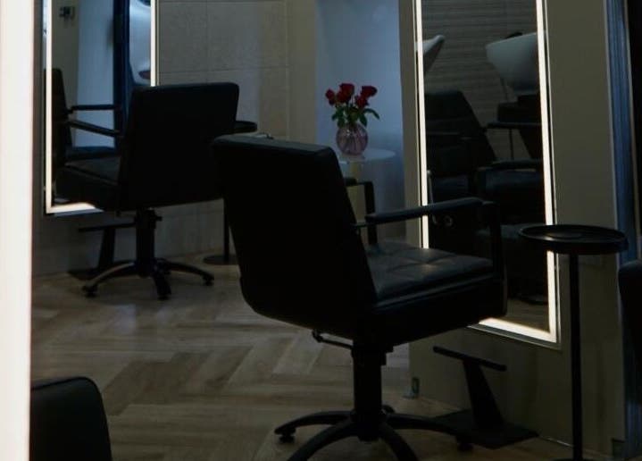 Elegant salon setup at Autumn & Easton, Glasgow, Scotland, GB featuring sleek chairs and stylish mirrors.