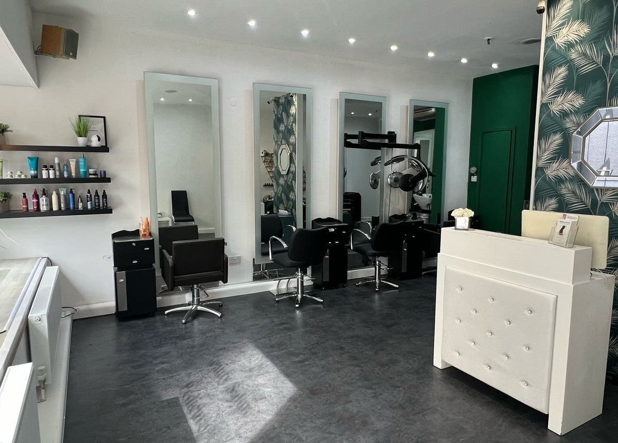 Elegant salon interior at 8 Harrow Place, London, England, GB with chic mirrors and styling chairs.