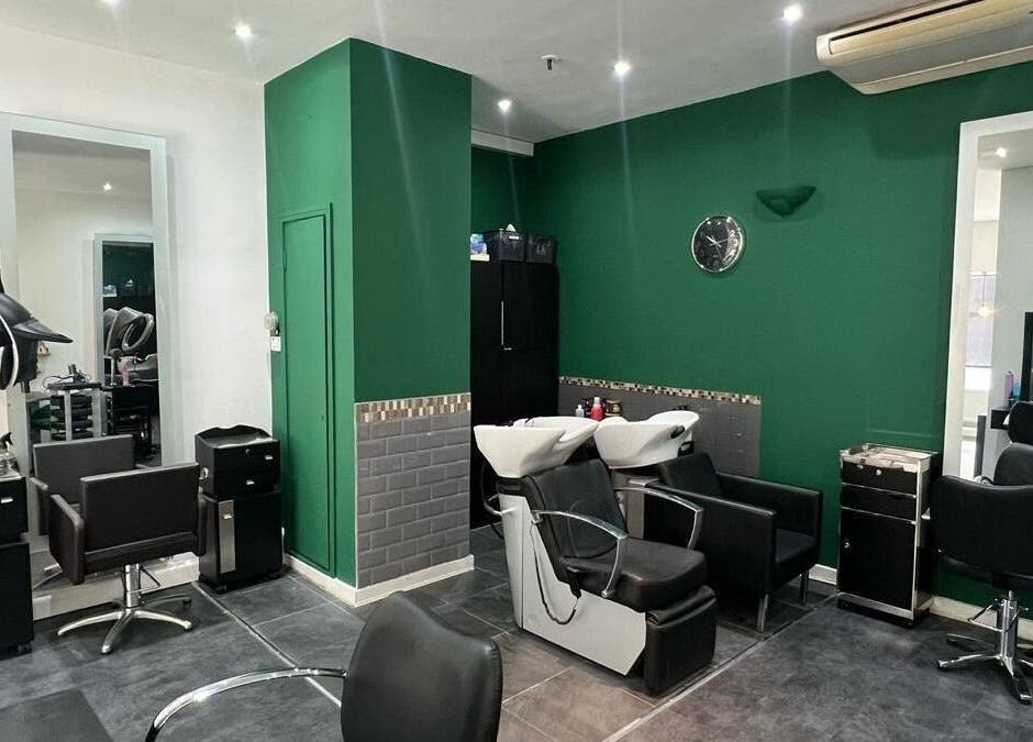 Modern salon setup at 8 Harrow place, London, England, GB featuring sleek chairs and wash stations.