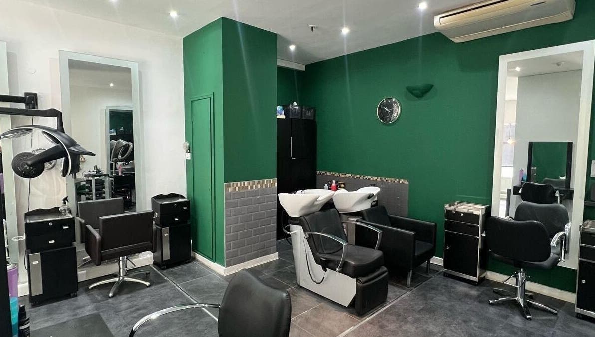 Modern salon interior at 8 Harrow Place, London, England, GB, featuring chic styling chairs and wash stations.