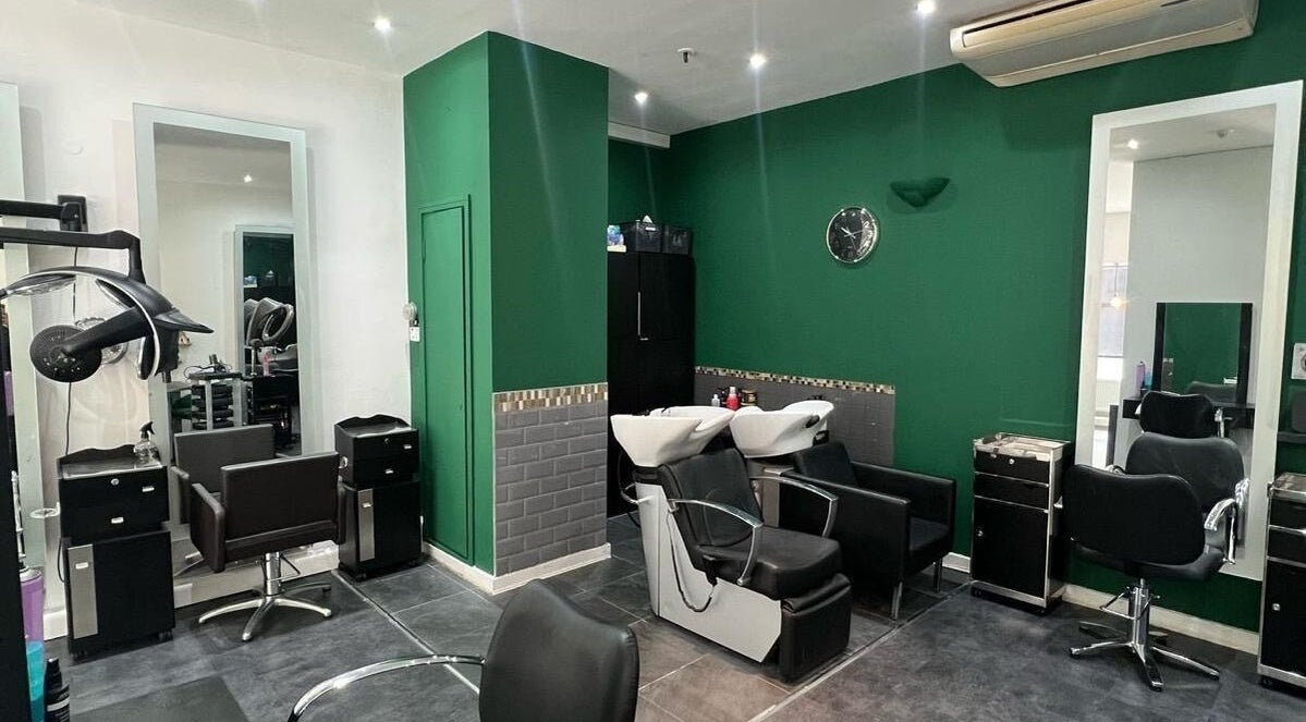 Modern salon interior at 8 Harrow Place, London, England, GB, featuring chic styling chairs and wash stations.