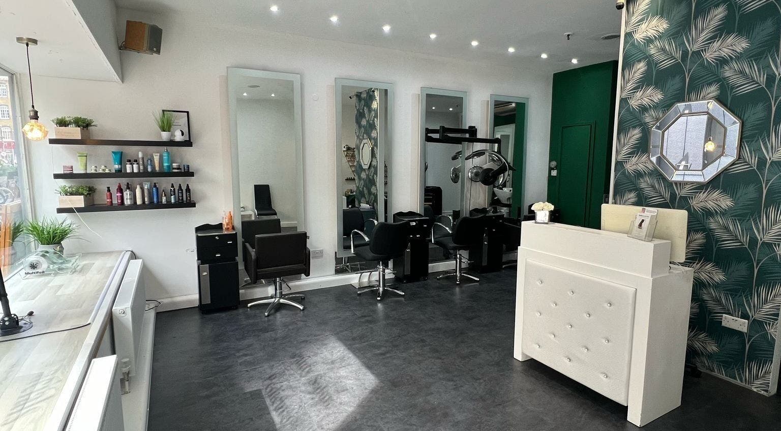 Elegant salon at 8 Harrow Place, London, England, GB with mirrors, styling chairs, and sleek decor.