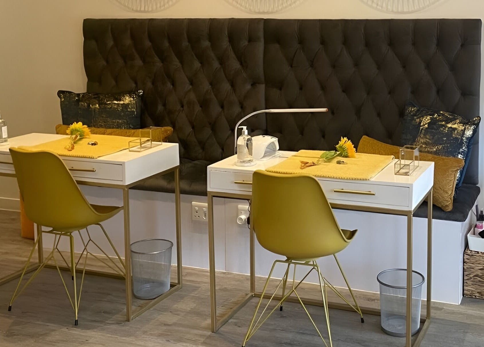 Modern manicure station at Sana Salon, Cape Town, Western Cape, ZA featuring plush seating and chic decor.