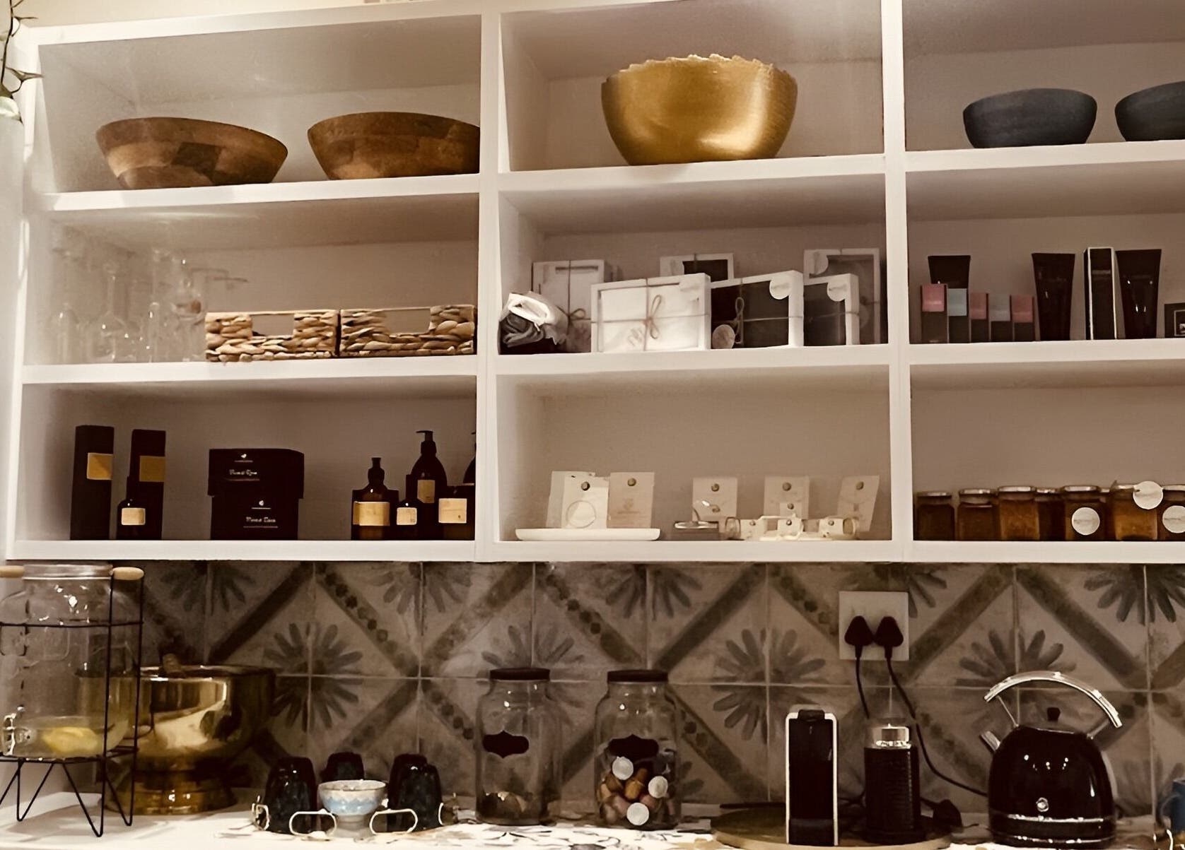 Products displayed on pristine shelves at Sana Salon in Cape Town, Western Cape, ZA.