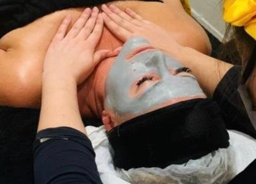 Relaxing facial treatment at Sana Salon, Cape Town, Western Cape, ZA. Aesthetician applies soothing mask.