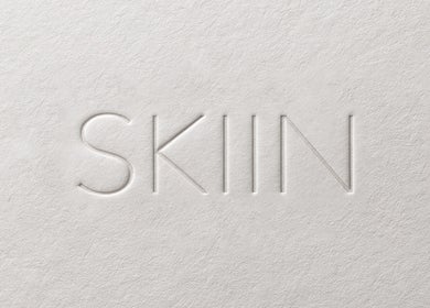 Embossed SKIIN logo on textured paper, Valongo, Porto, PT.