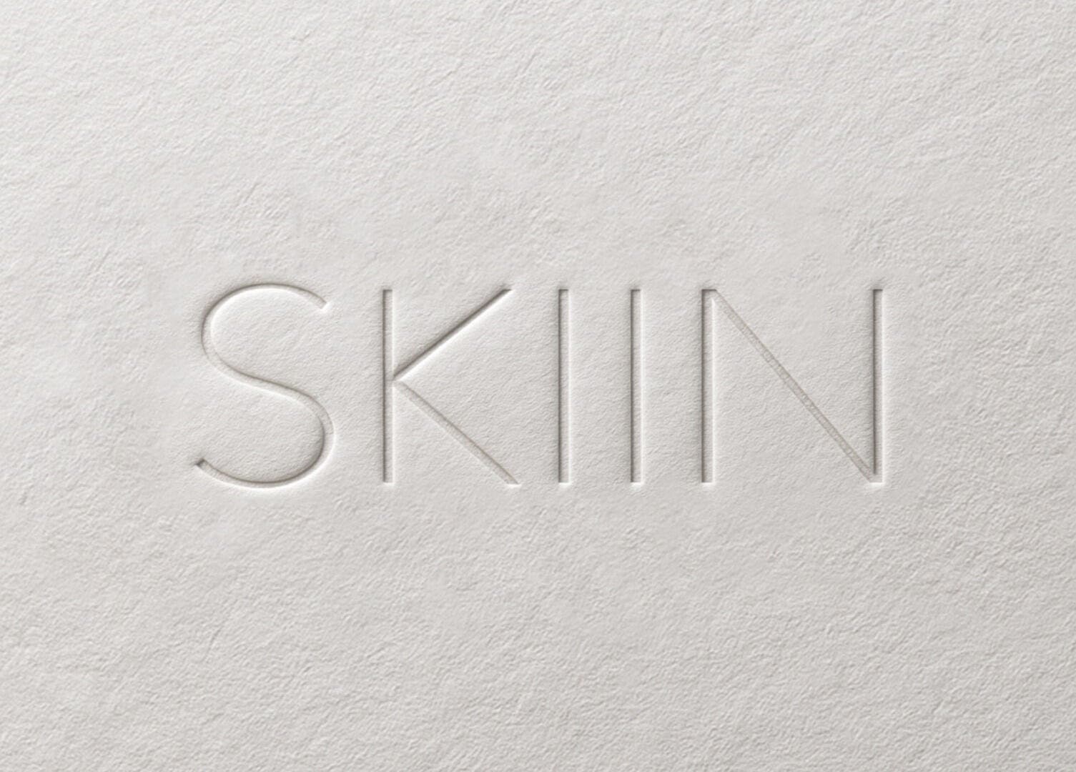 Embossed SKIIN logo on textured background, Valongo, Porto, PT.
