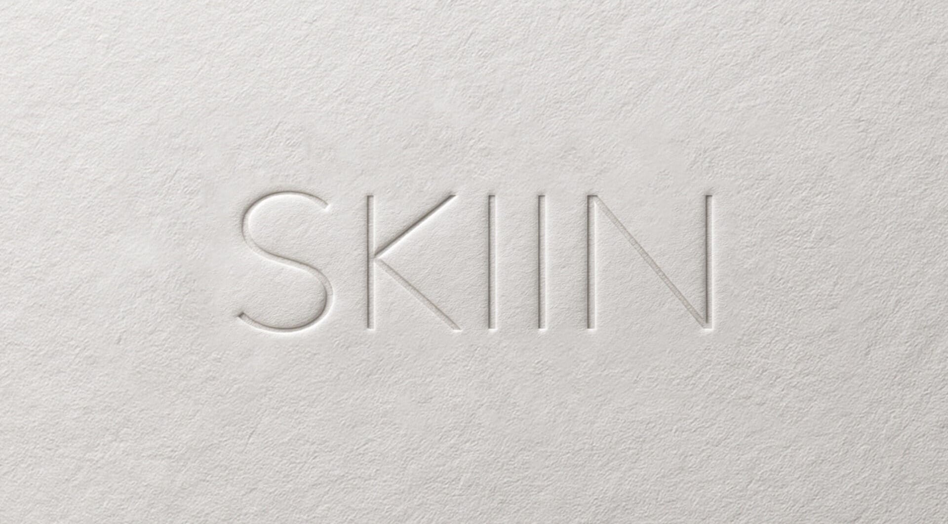 Embossed SKIIN logo on textured background, Valongo, Porto, PT.