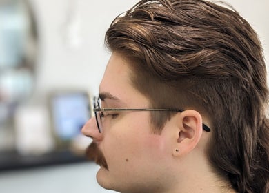 Trendy mullet hairstyle at Hair Creations by Pagie Xox in Maryville, Illinois, US.