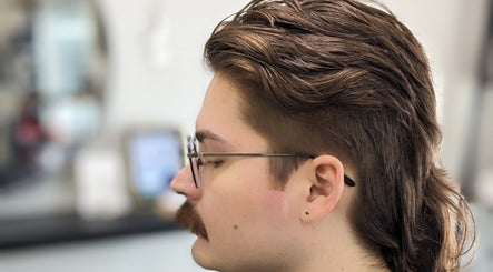 Trendy mullet hairstyle at Hair Creations by Pagie Xox in Maryville, Illinois, US.