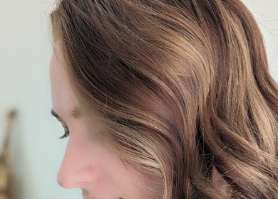 Modern wavy hairstyle at Hair Creations by Pagie Xox, Maryville, Illinois, US.