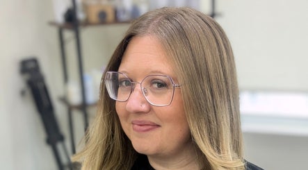 Client with sleek hairstyle at Hair Creations by Pagie Xox in Maryville, Illinois, US.