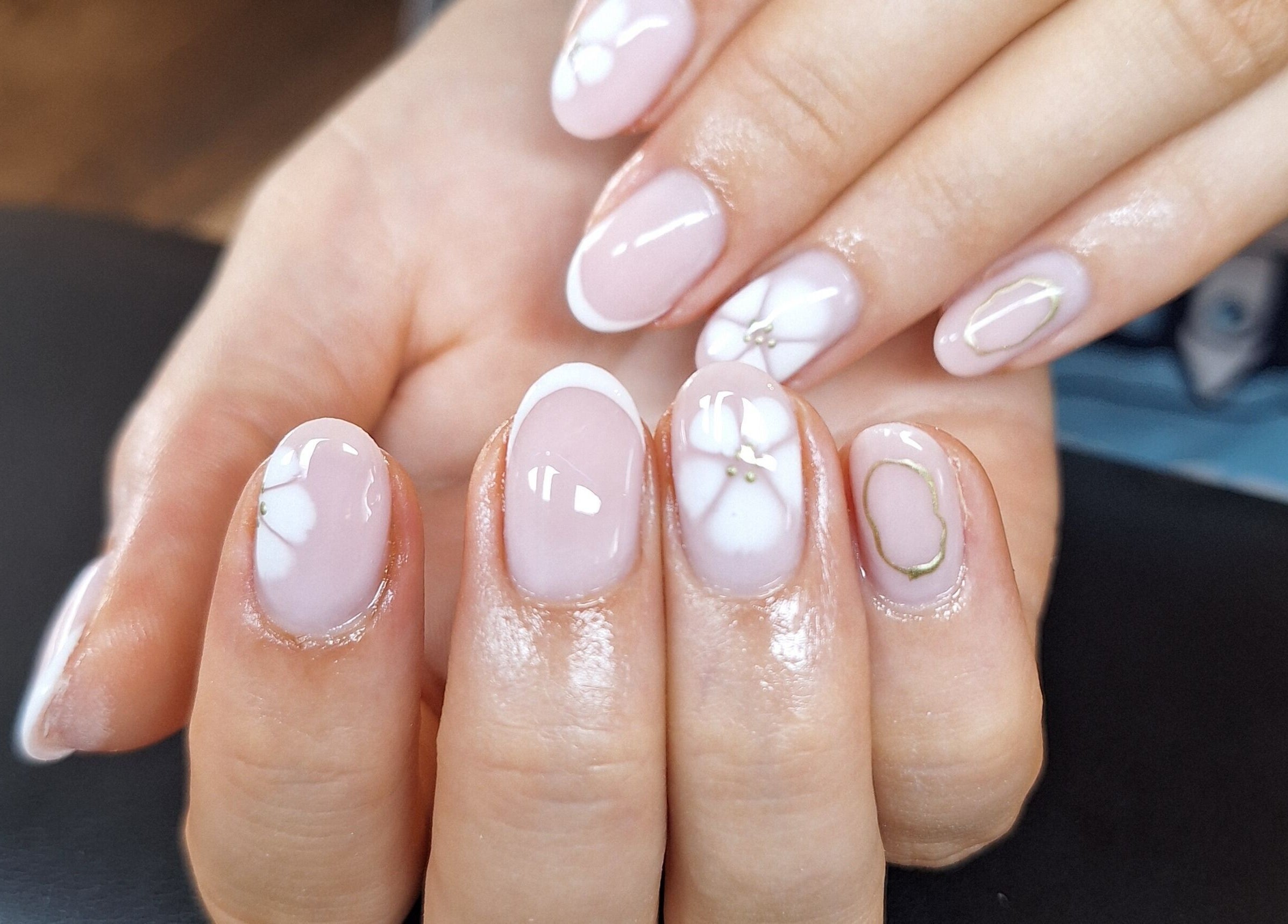 Elegant manicured nails at Bee Beautiful, Caistor, England, GB, showcasing intricate nail art design.