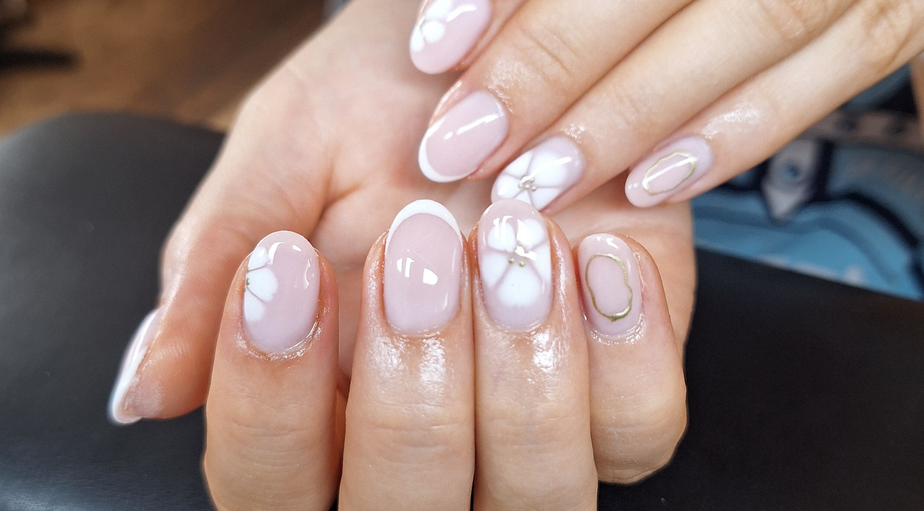 Elegant manicured nails at Bee Beautiful, Caistor, England, GB, showcasing intricate nail art design.