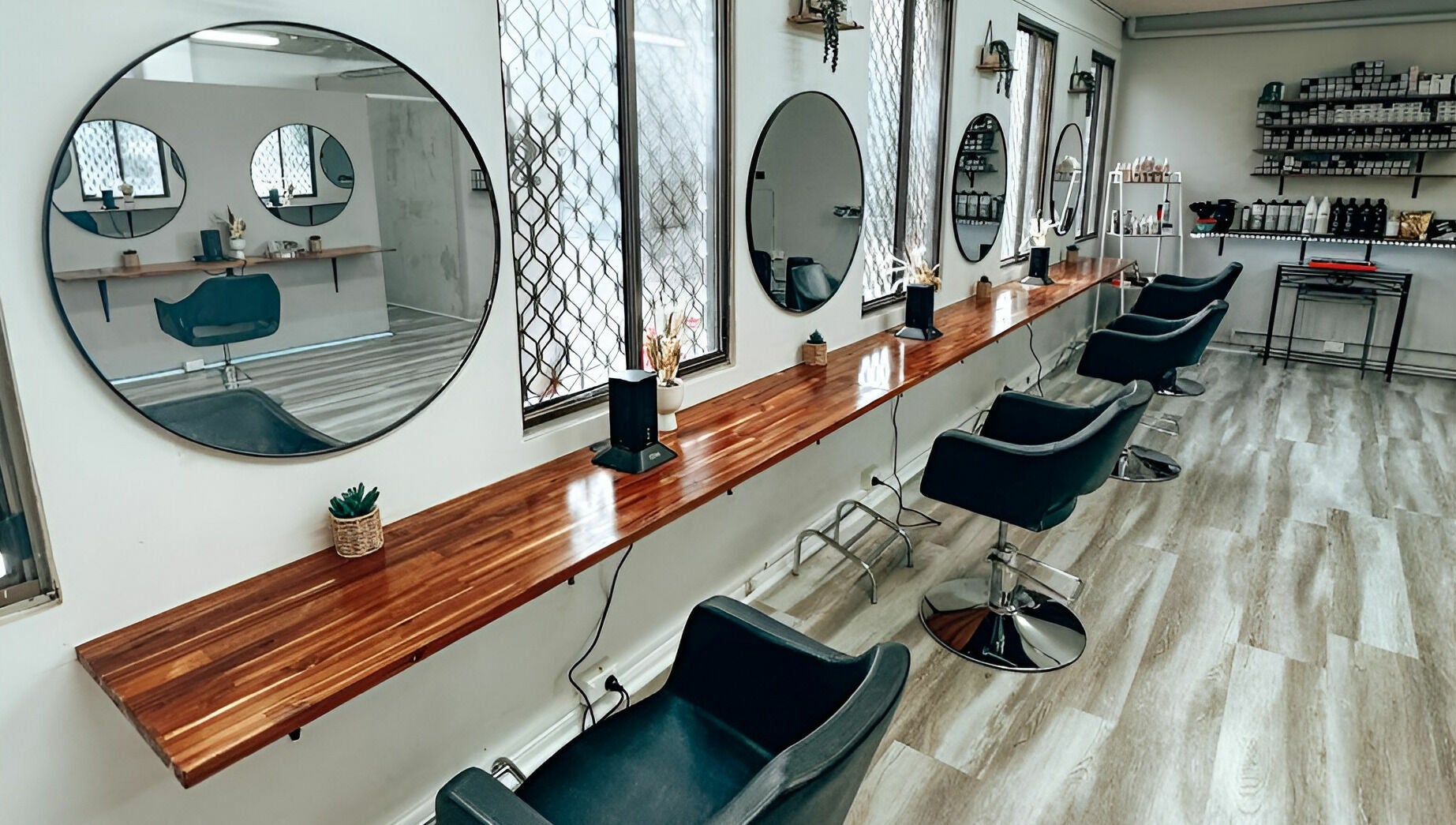 Modern salon interior at M2M By Michael in Penrith, New South Wales, AU, featuring stylish chairs and mirrors.