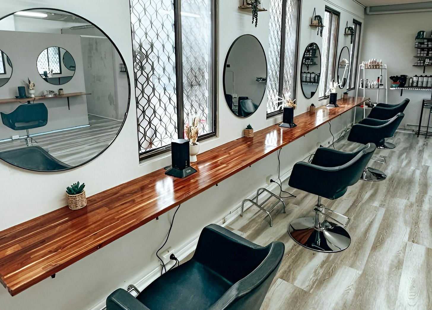 Modern salon interior at M2M By Michael in Penrith, New South Wales, AU, featuring stylish chairs and mirrors.