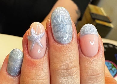 Elegant silver star nail art at Groovy Beauty Studio, Idaho Falls, Idaho, US.