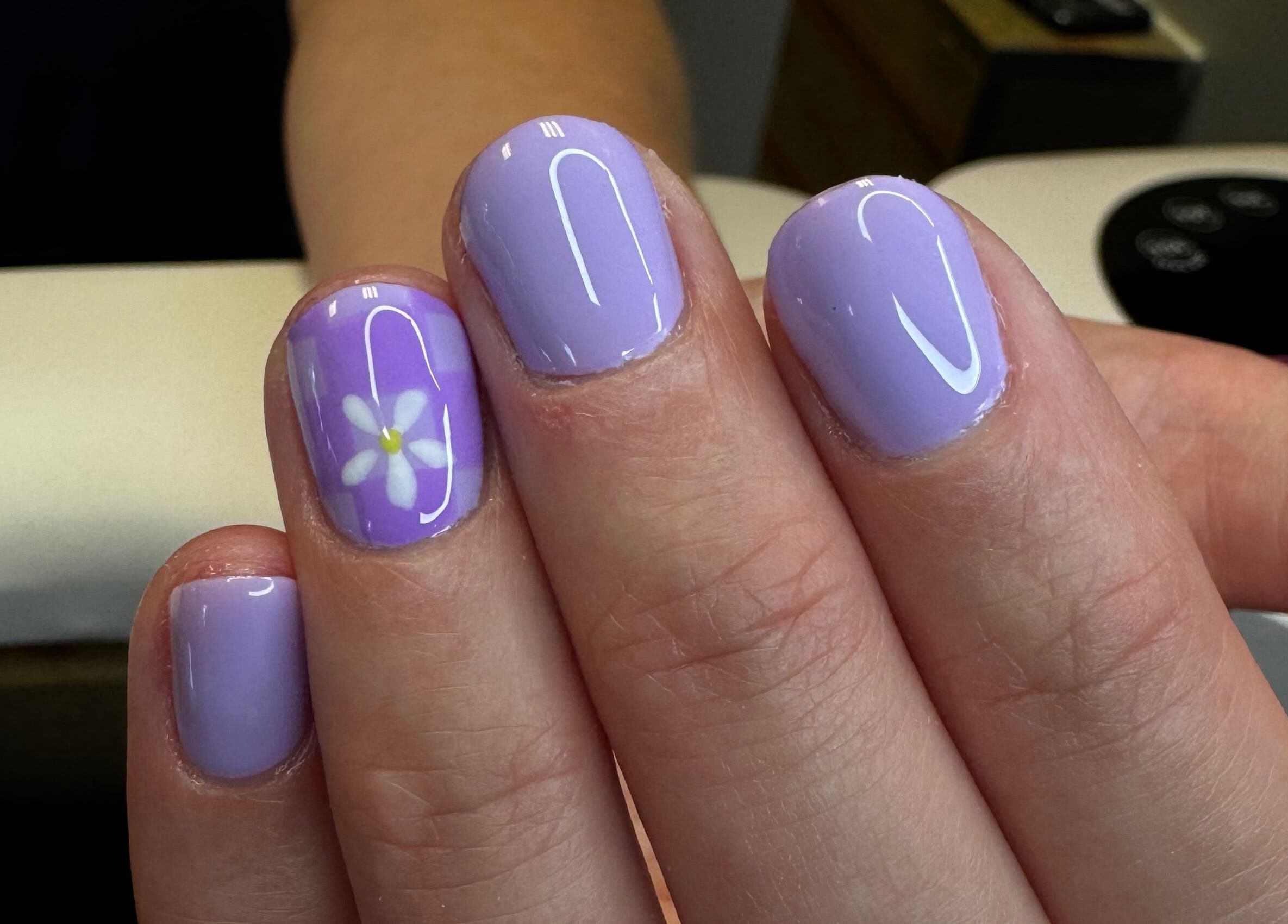 Lavender nails with flower design at Groovy Beauty Studio, Idaho Falls, Idaho, US.