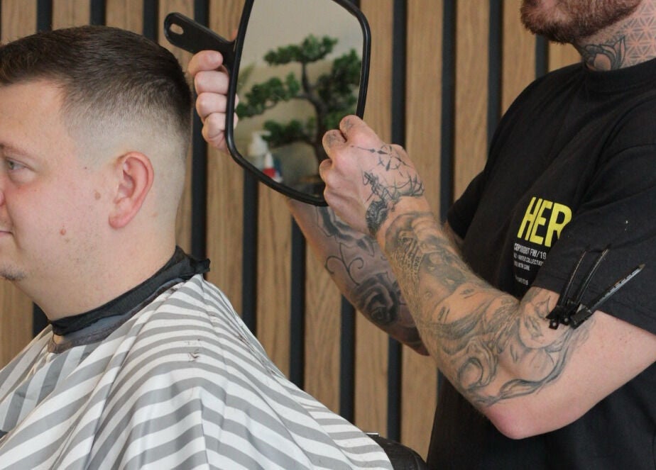 Barber styling a trendy haircut at Section Yas Bay, Abu Dhabi, AE.