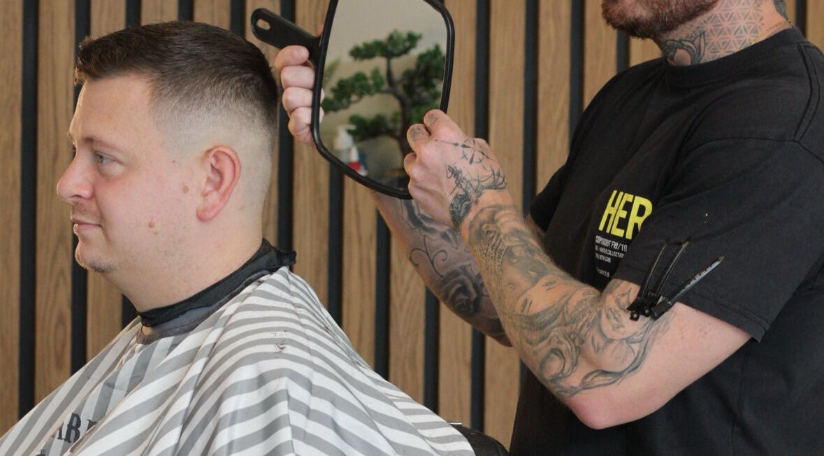 Barber styling a trendy haircut at Section Yas Bay, Abu Dhabi, AE.