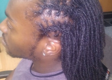 Expertly styled dreadlocks at Isl Hair Care, Lawrence, Kansas, US, showcasing professional hair artistry.
