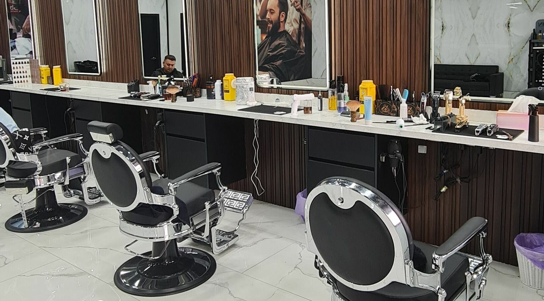 Modern barbershop interior at Lygon St Barbers, Melbourne, Victoria, AU featuring stylish chairs and grooming tools.