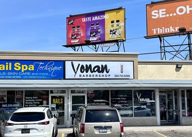 Exterior view of Yonan's Barber Shop in Hamilton, Ontario, CA showcasing signage and entrance.