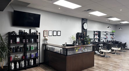 Modern interior of Yonan's Barber Shop in Hamilton, Ontario, CA, featuring stylish chairs and grooming products.