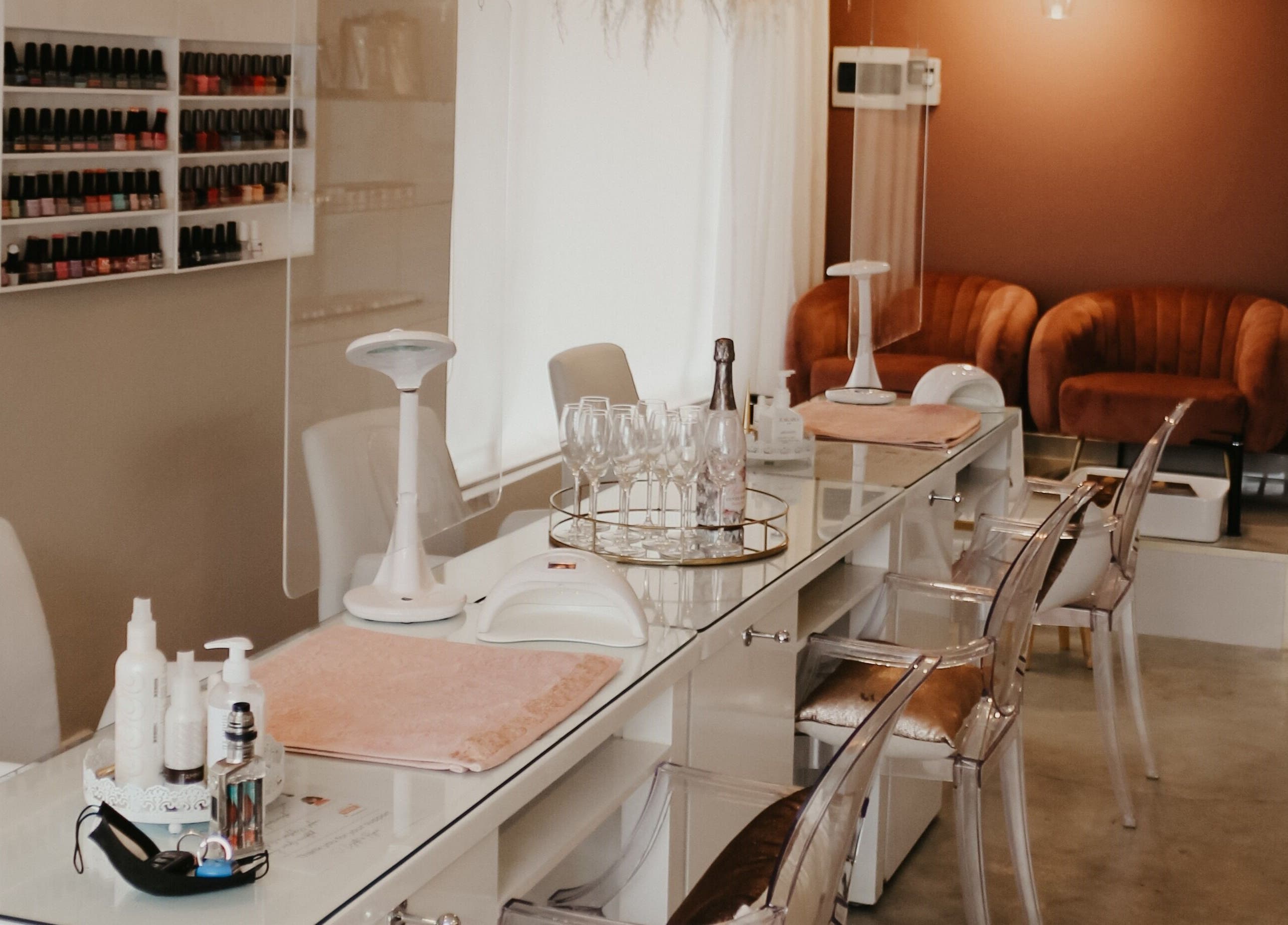 Elegant manicure station at Femme Aesthetics, Pretoria, Gauteng, ZA. Comfortable seating and modern design.