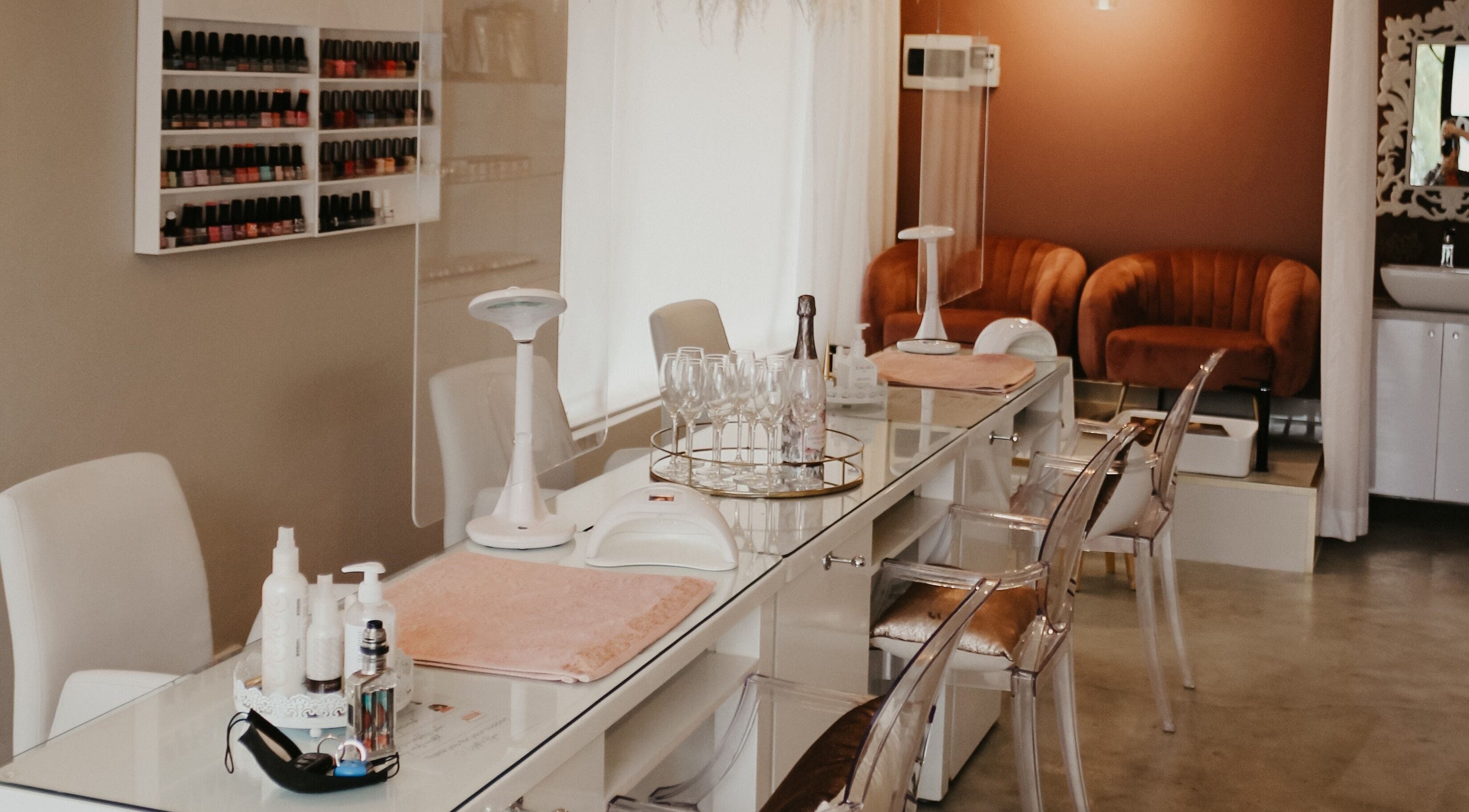 Elegant manicure station at Femme Aesthetics, Pretoria, Gauteng, ZA. Comfortable seating and modern design.