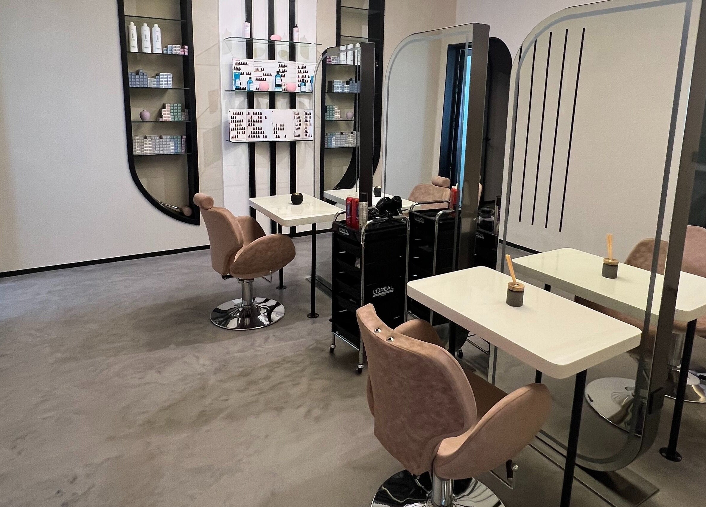 Modern salon interior at Lolia Salon and Spa, Riyadh, Riyadh Province, SA, featuring sleek styling stations.