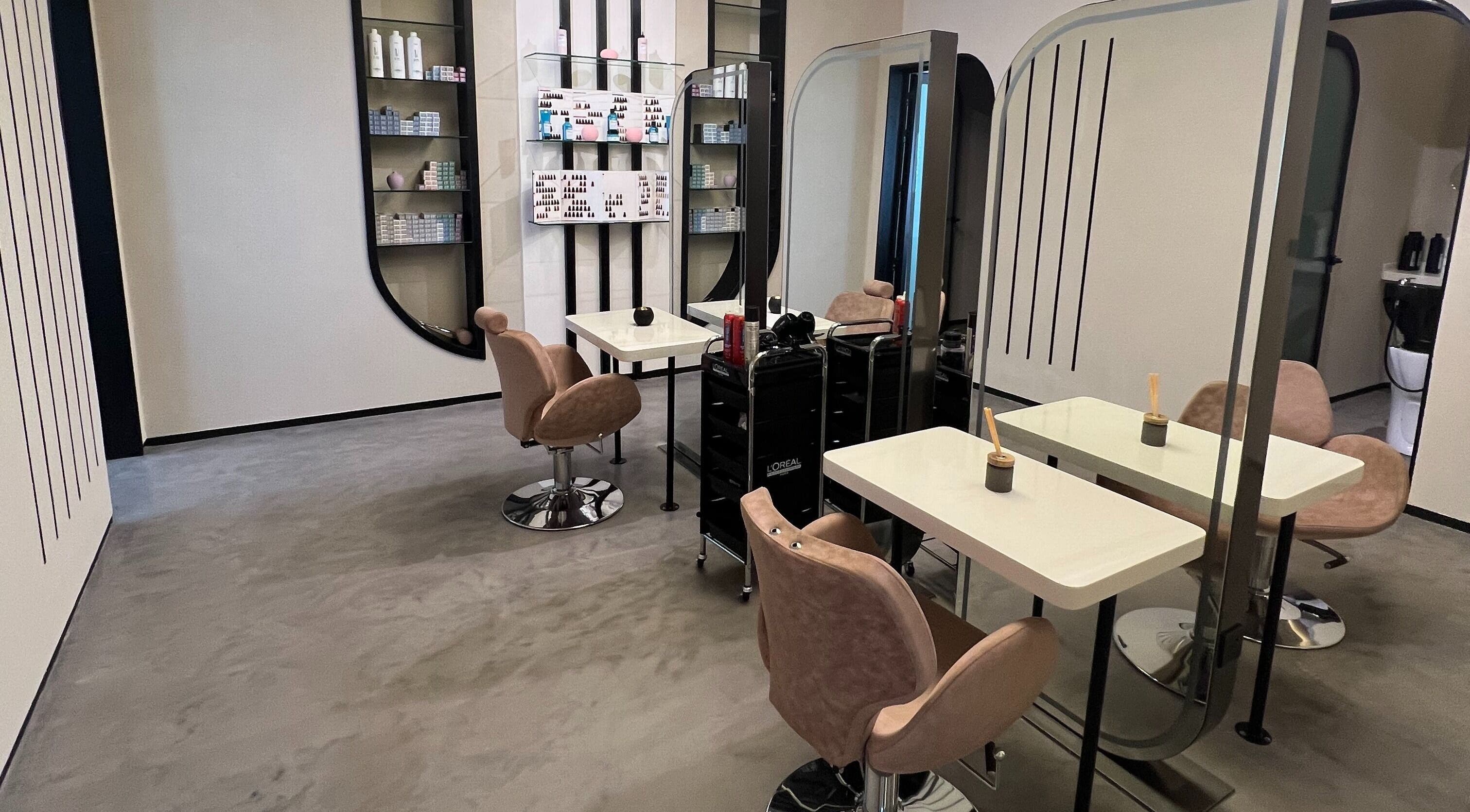 Modern salon interior at Lolia Salon and Spa, Riyadh, Riyadh Province, SA, featuring sleek styling stations.